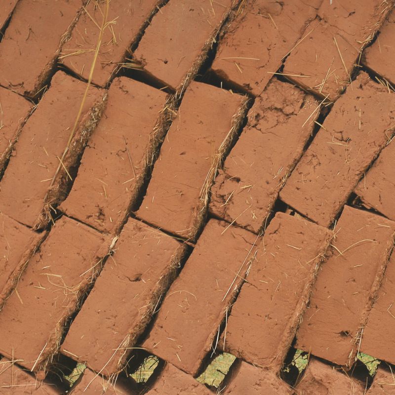 Earth bricks laid in traditional pattern.