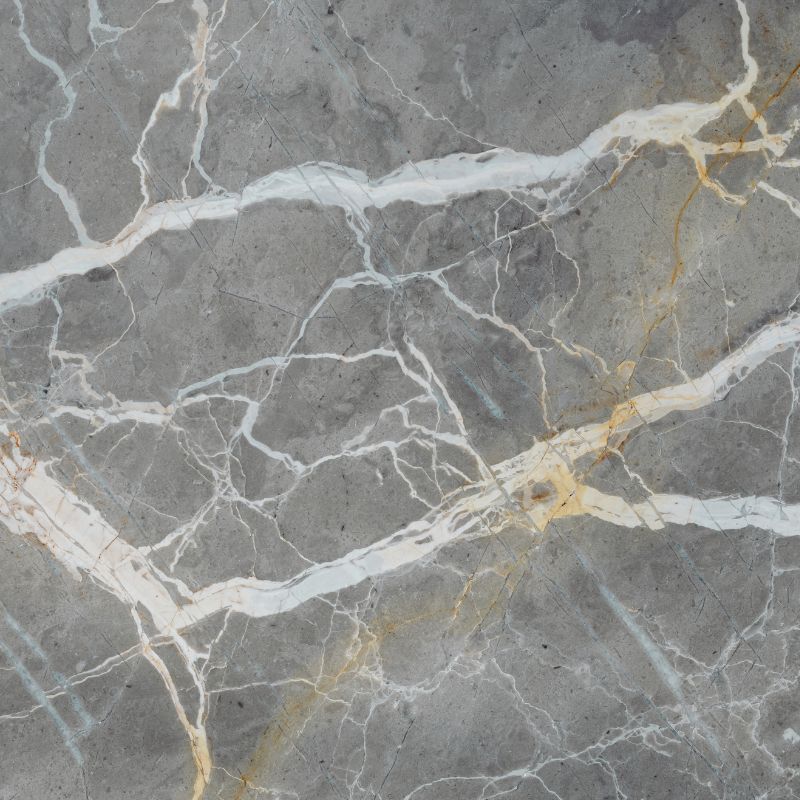 Close-up of marble stone with white and gold veins.